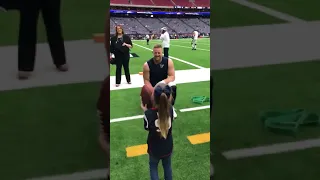 NFL Player J J  Watt Tosses a Football With Young Fan