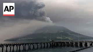 Indonesians leave homes near erupting volcano, airport closes due to ash danger