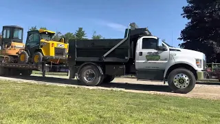 F750 dump truck pulling 20 ton trailer