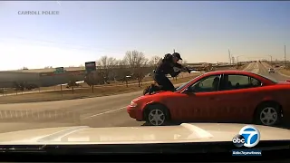 Video shows police officer holding on to fleeing car before ejection