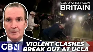 Riot police STORM US university campus as violent CLASHES break out among 'anti-western' protestors