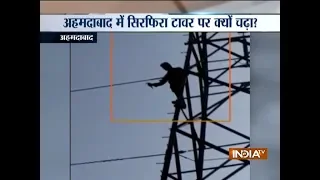 Ahmedabad man climbs up high tension electricity tower with knife in hand, incident caught on camer