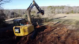 TAKING DOWN BIG TREES IS NOTHING FOR THE CAT 308 LAND CLEARING FOR HOUSE SITE…