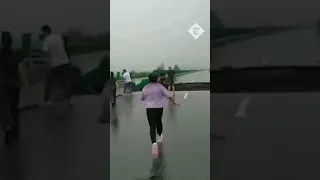 Moment cars fall into void left by a collapsed bridge near Beijing amid massive flooding