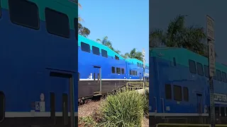 Rewrapped Coaster 2301 departs Carlsbad Village with a bad horn