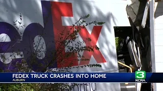 Auburn home partially wrecked after FedEx truck crashes inside