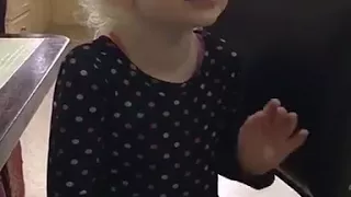 Cute small girl sings a Christmas song