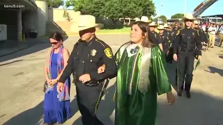 Peace officers escort Southwest High School graduate whose father was killed in the line of duty