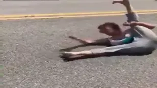 Too High Woman Rolling Around in Middle of Street