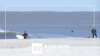 Early morning surfers enjoy high swells from Hurricane Lee