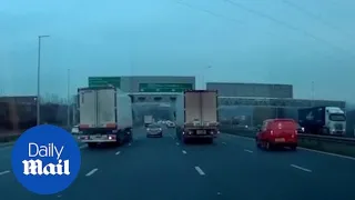 Terrifying moment a car is hit and goes for a spin on busy motorway