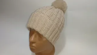 This year's hat with knitting needles. Hat in a relief pattern