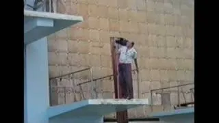 Cameraman falls off high dive board