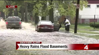 Heavy rains flood highways and basements