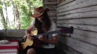 Lauri Porra plays Brian Eno on acoustic bass guitar by the lake