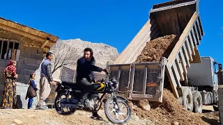 Excavation from the truck by Elham's father to make the platform in front of the house