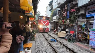 Hanoi [河内] 03 - At Train Street, while people are working and dining, train just whiz by inches away