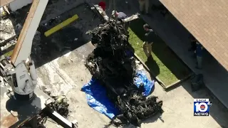 Crane used to remove chopper crash wreckage in Pompano Beach