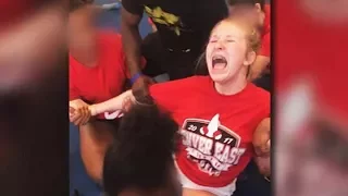 Cheerleader Screams As Teammates Force Her Into Split (VIDEO)