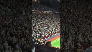 Villa fans in the Holte End singing against Blues