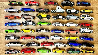 Box full of various miniature cars Jaguar, Peugeot, Renault, Hyundai, Mazda, Volvo, Honda, Opel #111