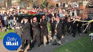 Keith Flint's coffin is carried into church by friends and fans