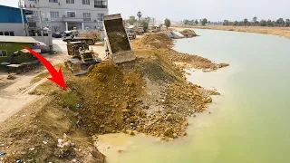 Excellent Work Truck Moving Huge Big land Unloading in Water on the canal By komat’su pushing land