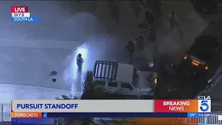 Pursuit, barricade suspect taken into custody in South L.A.