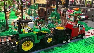 Custom LEGO John Deere farm tractor, sun shade and attaching implements.