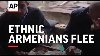 Ethnic Armenians flee as area turned to Azerbaijan
