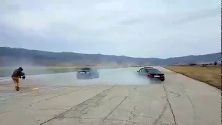 BMW e34 540i donuts around Mercedes C63 AMG