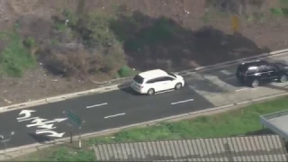 Police chase possibly armed suspect through San Fernando Valley