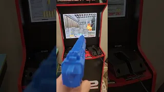 Arcade1up Terminator T2 cab siden light gun mod concept with spinner and pedals for time crisis
