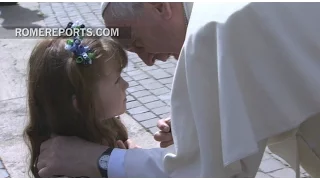 Pope blesses a girl who will lose her eyesight and hearing due to a degenerative disease