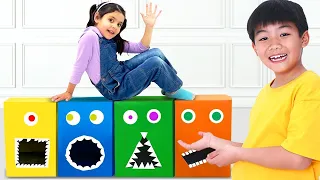 ¡Ellie y Eric Alimentan las Cajas Hambrientas y Aprenden Colores, Formas, y Compartir!
