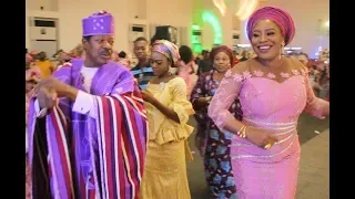 Beautiful Women surrounds King Sunny Ade as they dance and spray money at his daughter's Wedding