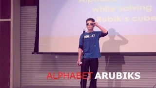 Kid solves Rubik's Cube while rapping Alphabet Aerobics