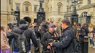 POLICE INTERVENE following fisticuffs at Horse Guards as The King's Guard looks bemused!