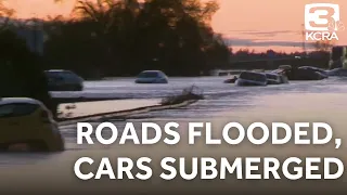 Highway 99 flooded, cars submerged