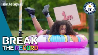 Watch Us Try To Break The Record For Distance Traveled On A Plastic Water Slide!