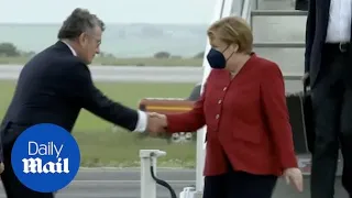 Angela Merkel arrives at Cornwall airport for G7 summit