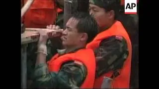 China - Soldiers try to repair broken dam