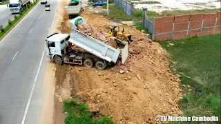 Wonderful KOMATSU Dozer D58P Pushing Soil Highwall & Truck Unloading In Medium Project Landfilling