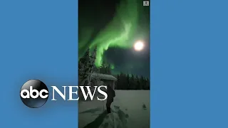 Skiers enjoy aurora borealis in Finland