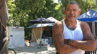 ‘They don’t want to be here.’ Scenes of a river homeless camp in Sacramento