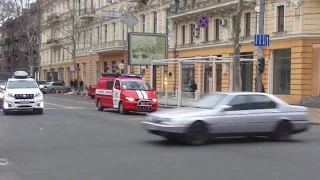 Command van crosses the intersection with wail and loudspeaker