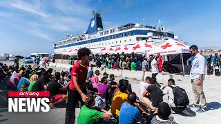 Tiny Italian island of Lampedusa overwhelmed as over 7,000 migrants arrive in just two days