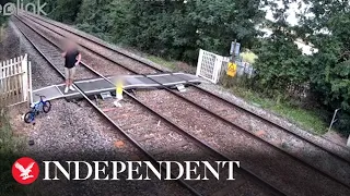 CCTV shows father leaving toddler walking on train track 'while he talks on mobile'