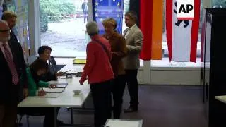 German Chancellor Merkel votes in election