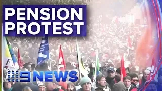 Protesters clash with riot police over pension reform in Paris | Nine News Australia